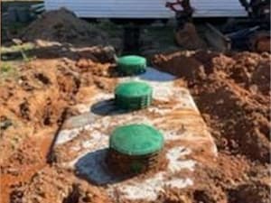 Reliable septic installation services by Sweet Septic Septic tanks being set in place as part of a new septic system installation