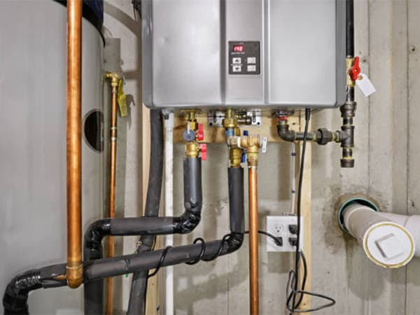 On-site septic pumping and maintenance services across the Houston area Septic service truck performing tank pumping with extended hose at a Houston property