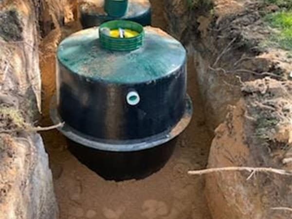 Multiple septic tanks installed underground during new construction project Multiple septic tanks installed underground during new construction project